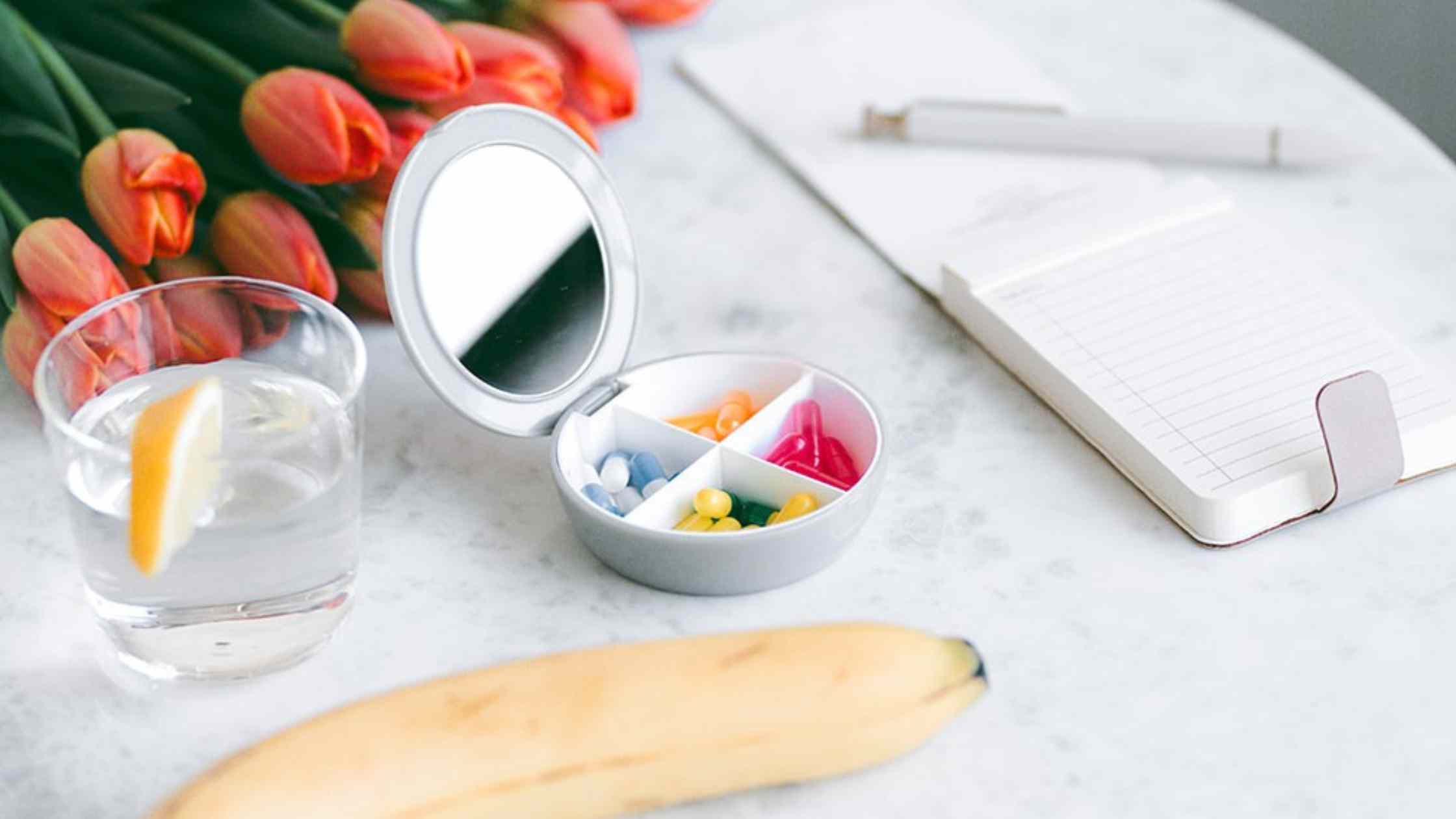 Travel PIll Organizer, Water With Lemon, Tulip Bouquet, Banana and Notepad with Pen